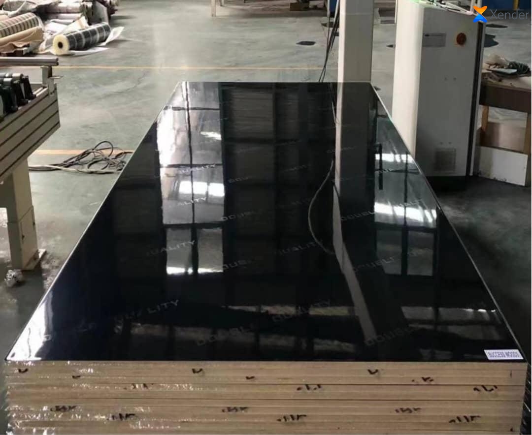 Mirror-finish gloss black laminated board on a stack of panels